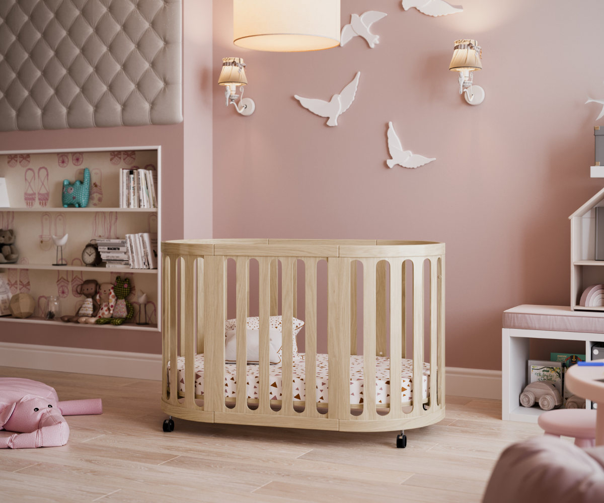 Modern wooden baby crib in a pink-themed nursery with toys and wall decorations, Babyhood GCC