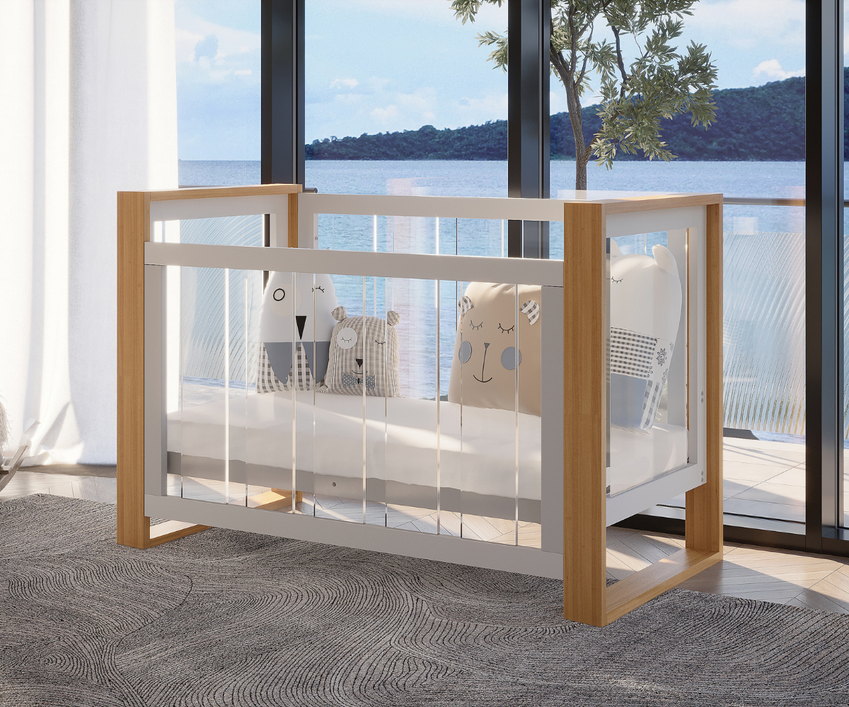 Modern baby crib with plush pillows, wood frame, large windows, and water view at Babyhood GCC