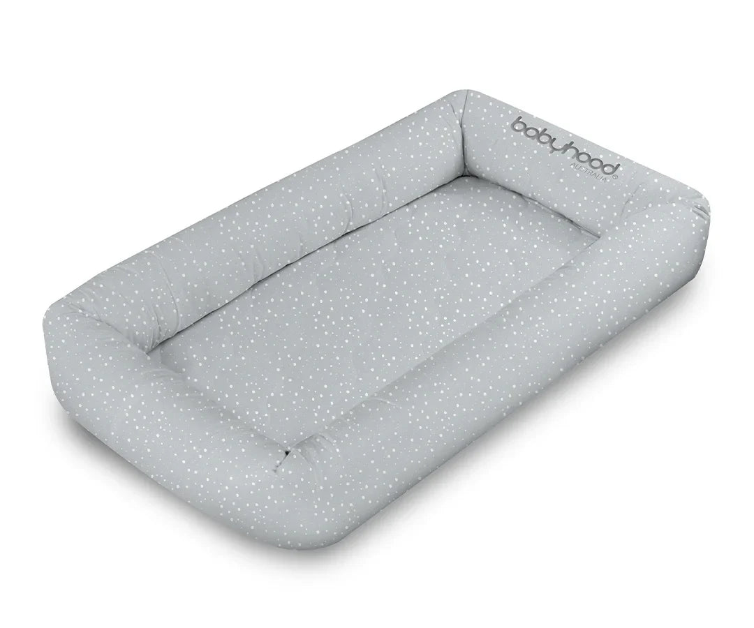 Babyhood grey crib with white dots, soft padded border, newborn sleep pod