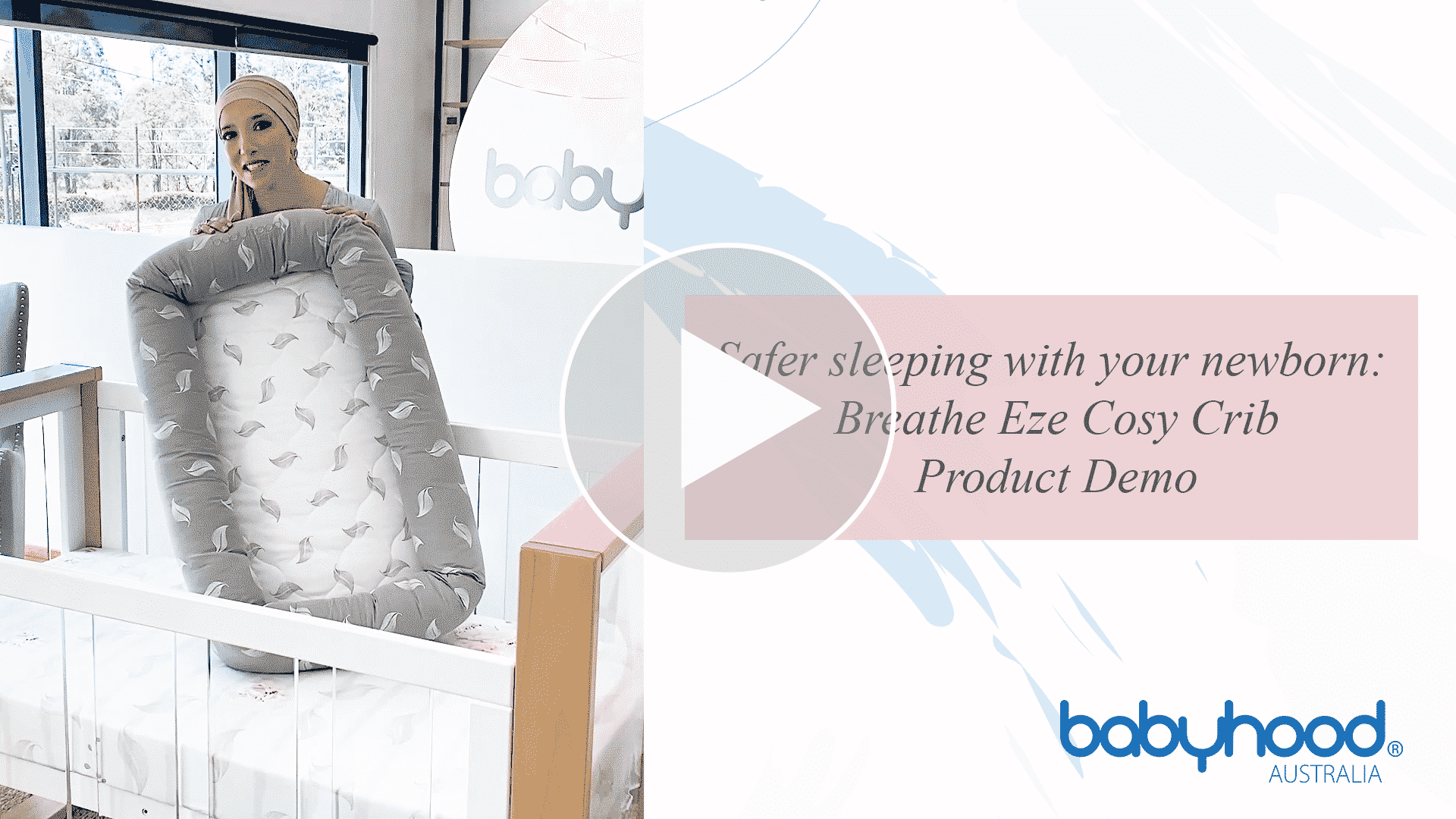 Woman demonstrating Babyhood Breathe Eze Cosy Crib in nursery setting, product demo