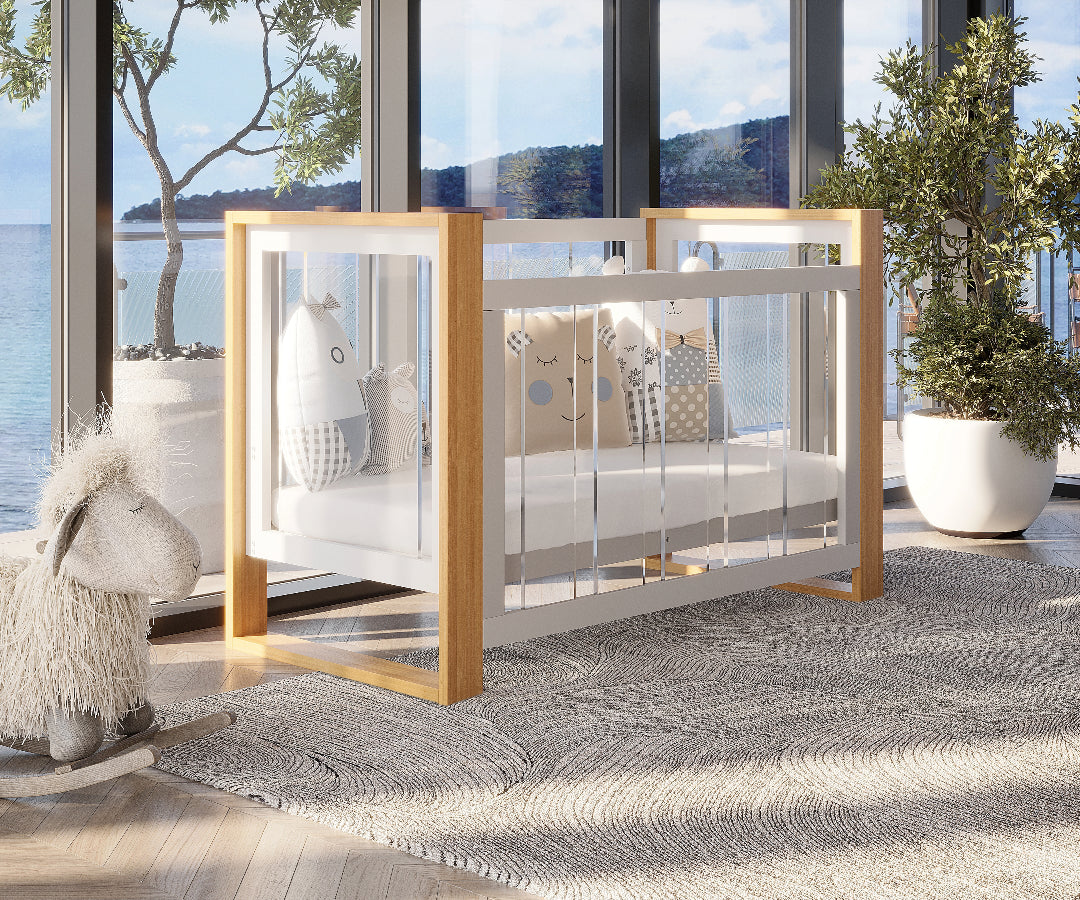 Modern baby crib with wooden frame, plush toys, and seaside view in sunlit nursery