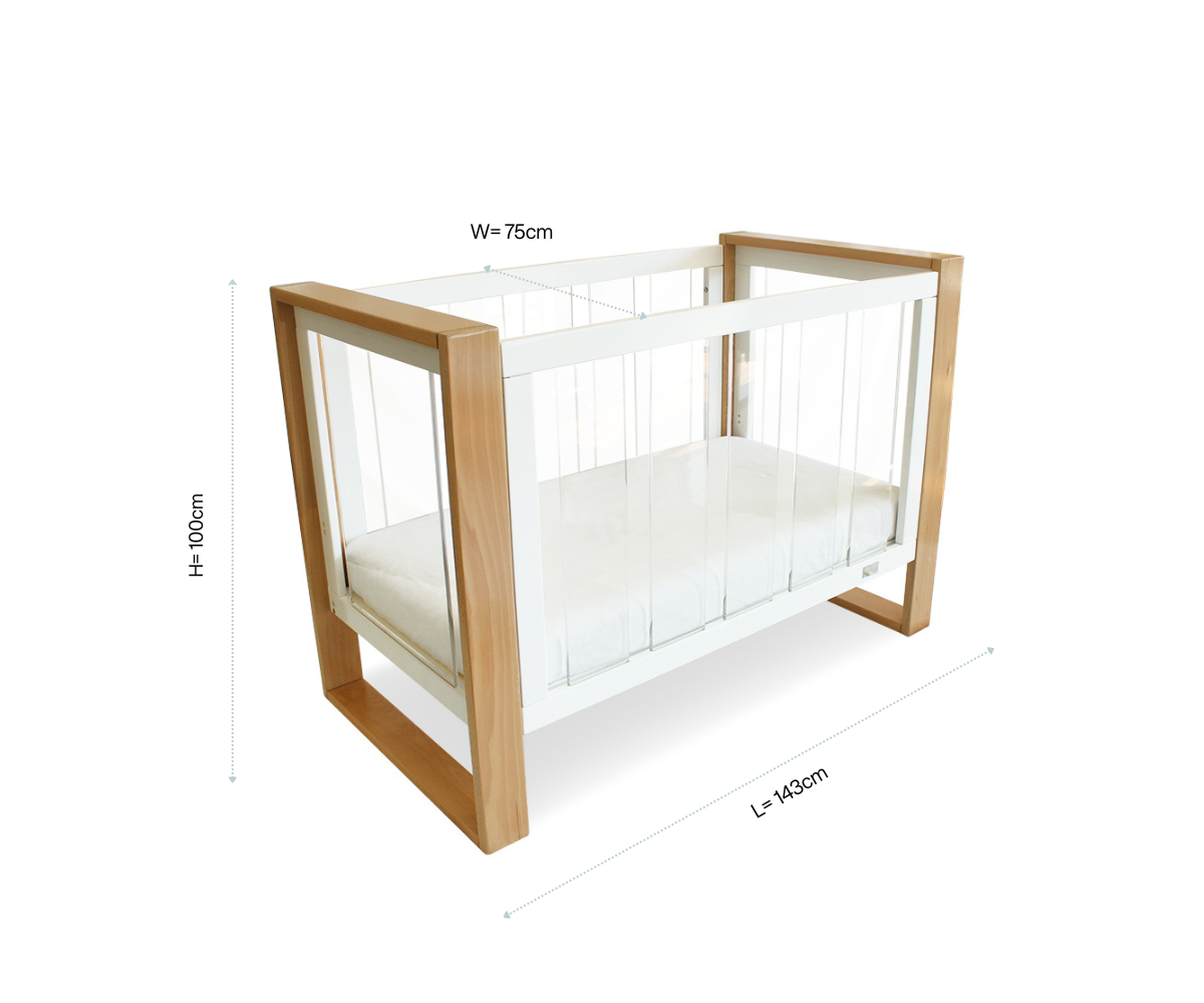 Modern baby crib with clear sides, wood frame, and labeled dimensions from Babyhood GCC