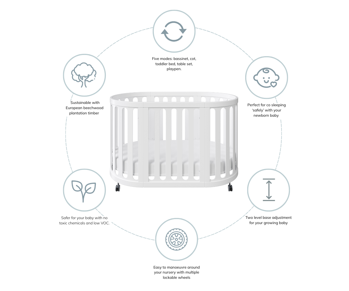 White oval baby cot with lockable wheels, adjustable base, and eco-friendly timber by Babyhood GCC