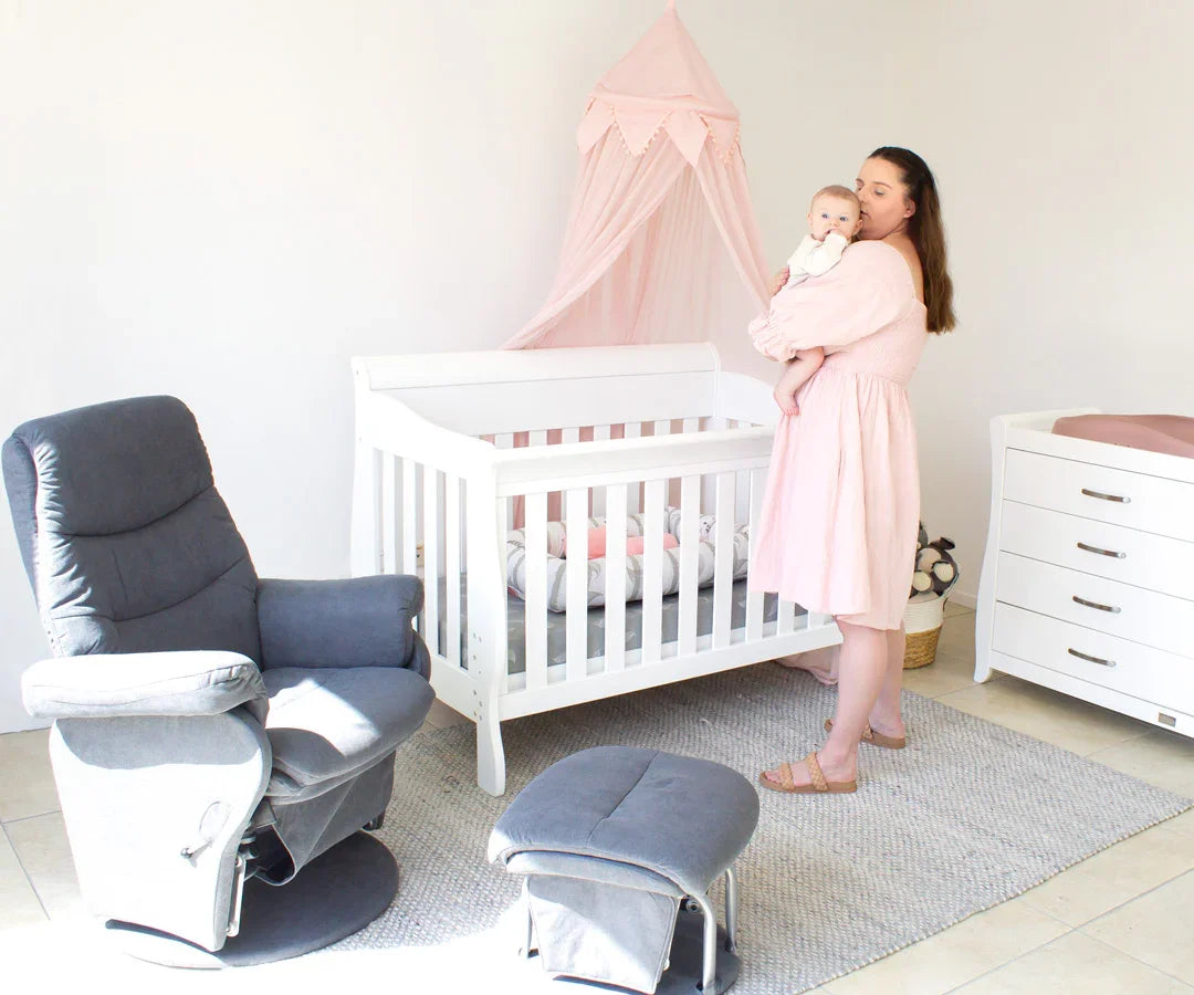 Amani Sleigh Cot — A timeless silhouette.
