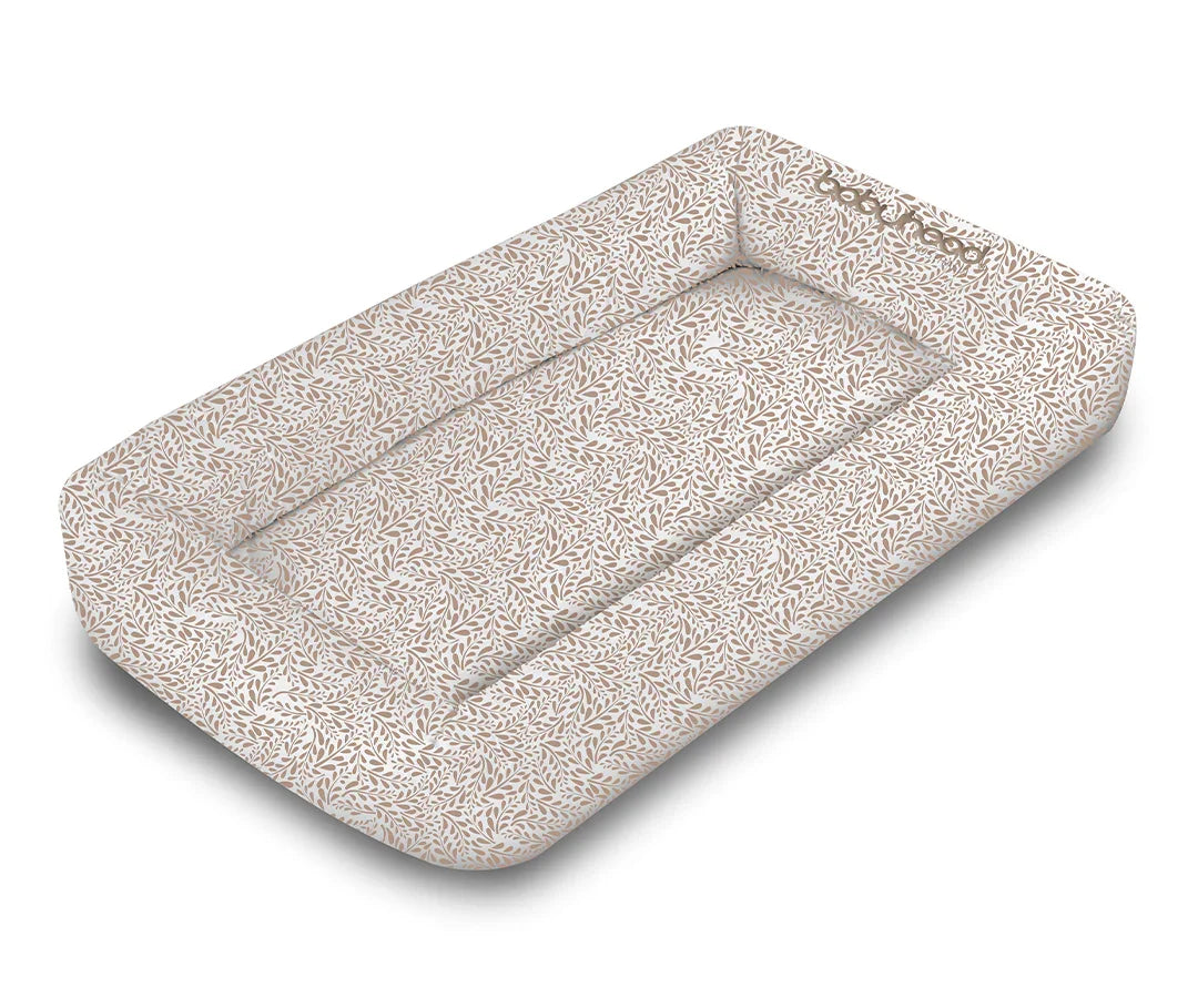 Babyhood cosy crib in Reed leaf print, soft padded baby lounger on white background