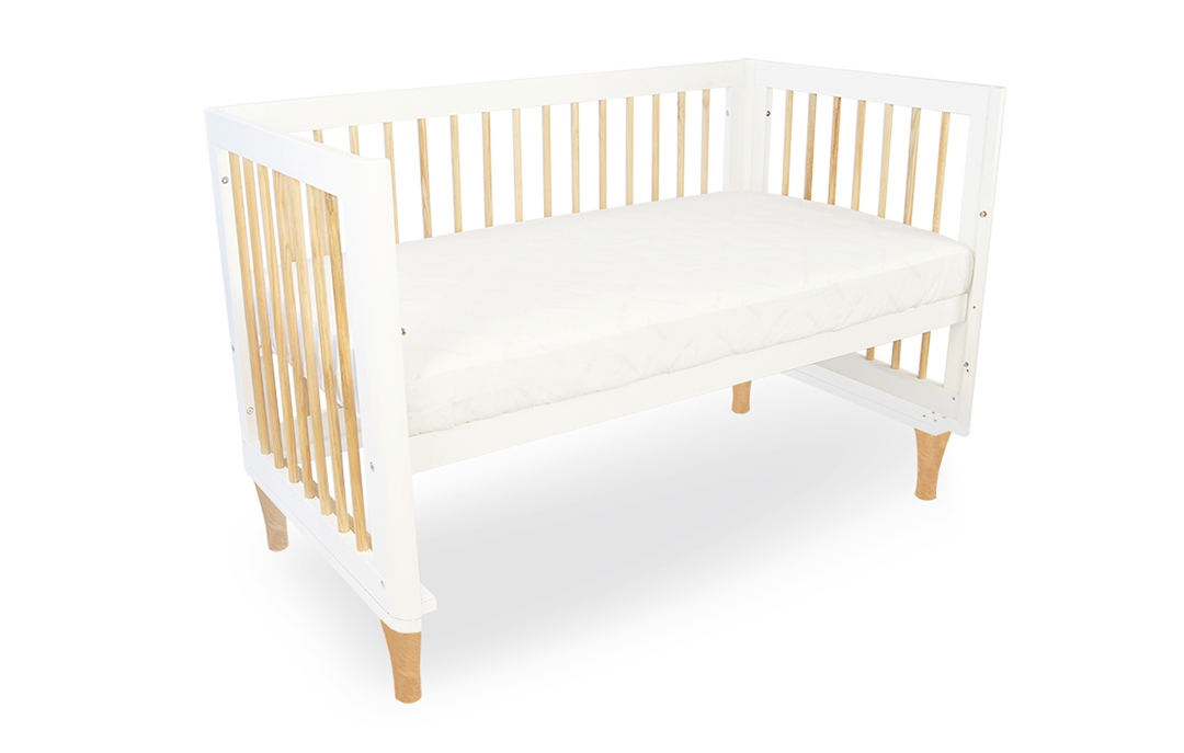 Babyhood white wooden cot with natural wood accents, modern nursery crib furniture