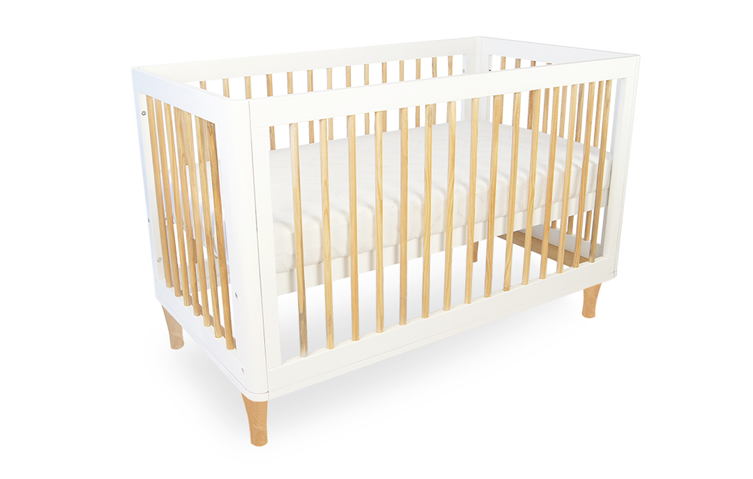 Modern white and natural wood baby bassinet crib from Babyhood GCC